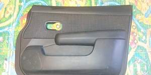 Обшивка двери передней правой для Nissan Tiida (C1 - Фото #1