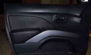Обшивка водит. двери Mitsubishi Outlander XL - Фото #1